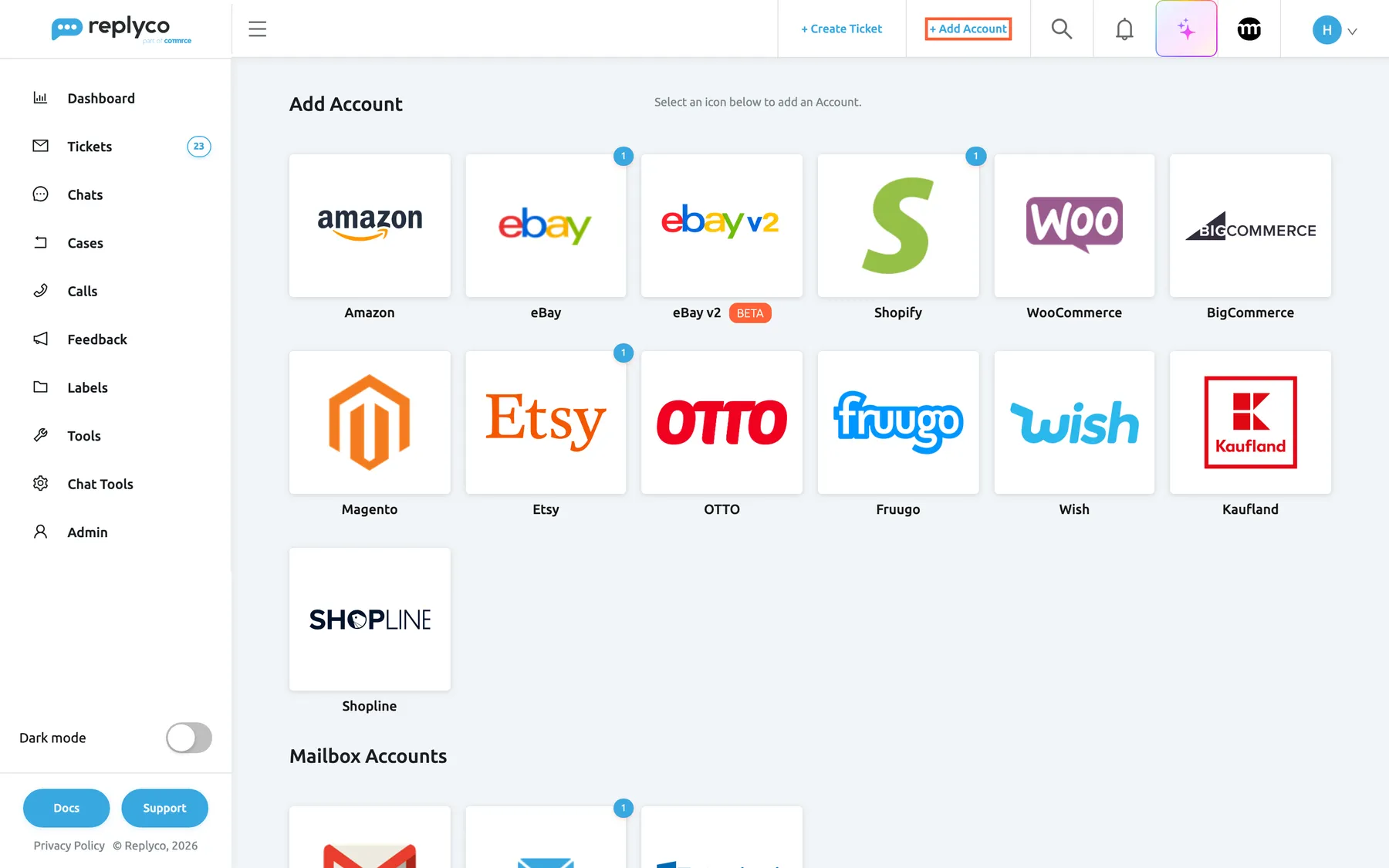 The Add Account page in Replyco. In the top bar, the link + Add Account that opens it is highlighted. Under the heading Add Account and the line "Select an icon below to add an Account." the first group shows one tile per marketplace and webstore: Amazon, eBay, eBay v2 with a BETA label, Shopify, WooCommerce, BigCommerce, Magento, Etsy, OTTO, Fruugo, Wish, Kaufland and Shopline. Small blue badges with the number 1 on the eBay, Shopify and Etsy tiles count the accounts already connected. The Mailbox Accounts group starts below.