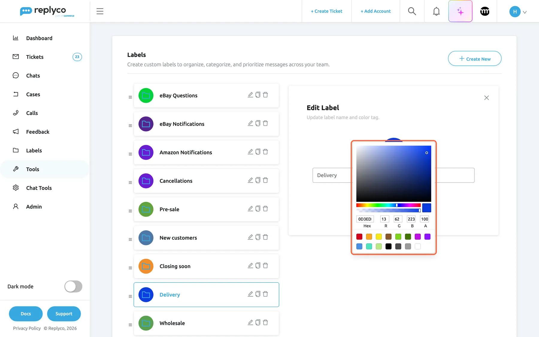 The Labels screen after the card Delivery was selected. The list narrows to the left with Delivery marked, and the Edit Label form opens on the right with the description "Update label name and color tag." and a close cross. The Label Name field holds Delivery. Selecting the blue round folder icon above the field has opened the colour picker, which is highlighted: a colour area, sliders for hue and transparency, fields for Hex (0D3EDF), R, G, B and A, and preset swatches. Cancel and Save sit under the field; Save stores the name and the colour.