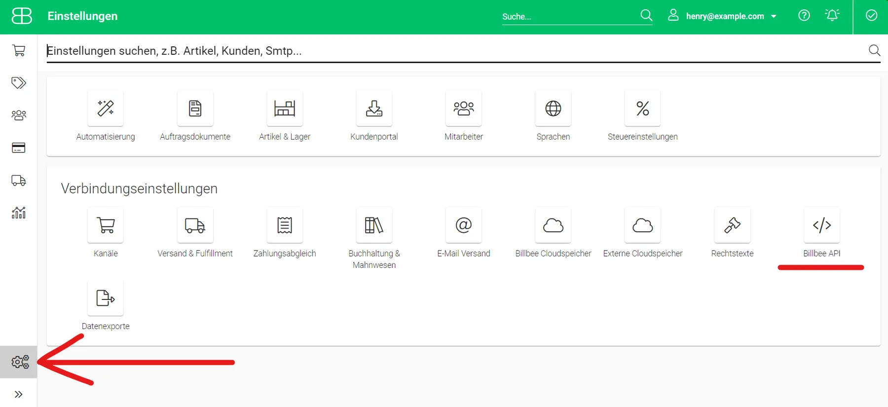 Billbee's settings page, shown here in Billbee's German interface: the green top bar reads "Einstellungen" (Settings), with a search field and the signed-in user's email. A red arrow points at the gear icon at the bottom of the left bar, which opens this page. Below the settings search, the upper group has tiles such as Automatisierung and Mitarbeiter; the group "Verbindungseinstellungen" (connection settings) has Kanäle, Versand & Fulfillment, E-Mail Versand and more, with "Billbee API" underlined in red.