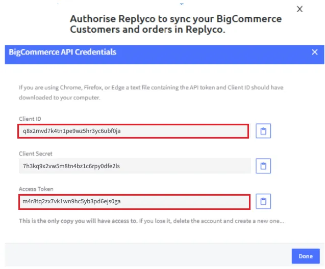 The BigCommerce API Credentials dialog that appears when you save the API account. It explains that in Chrome, Firefox or Edge a text file with the API token and Client ID should have downloaded to your computer. Three fields follow, each with a copy button: Client ID and Access Token are outlined in red, Client Secret between them is not. The values shown are examples. The note below reads "This is the only copy you will have access to. If you lose it, delete the account and create a new one", and the Done button sits at the bottom right.